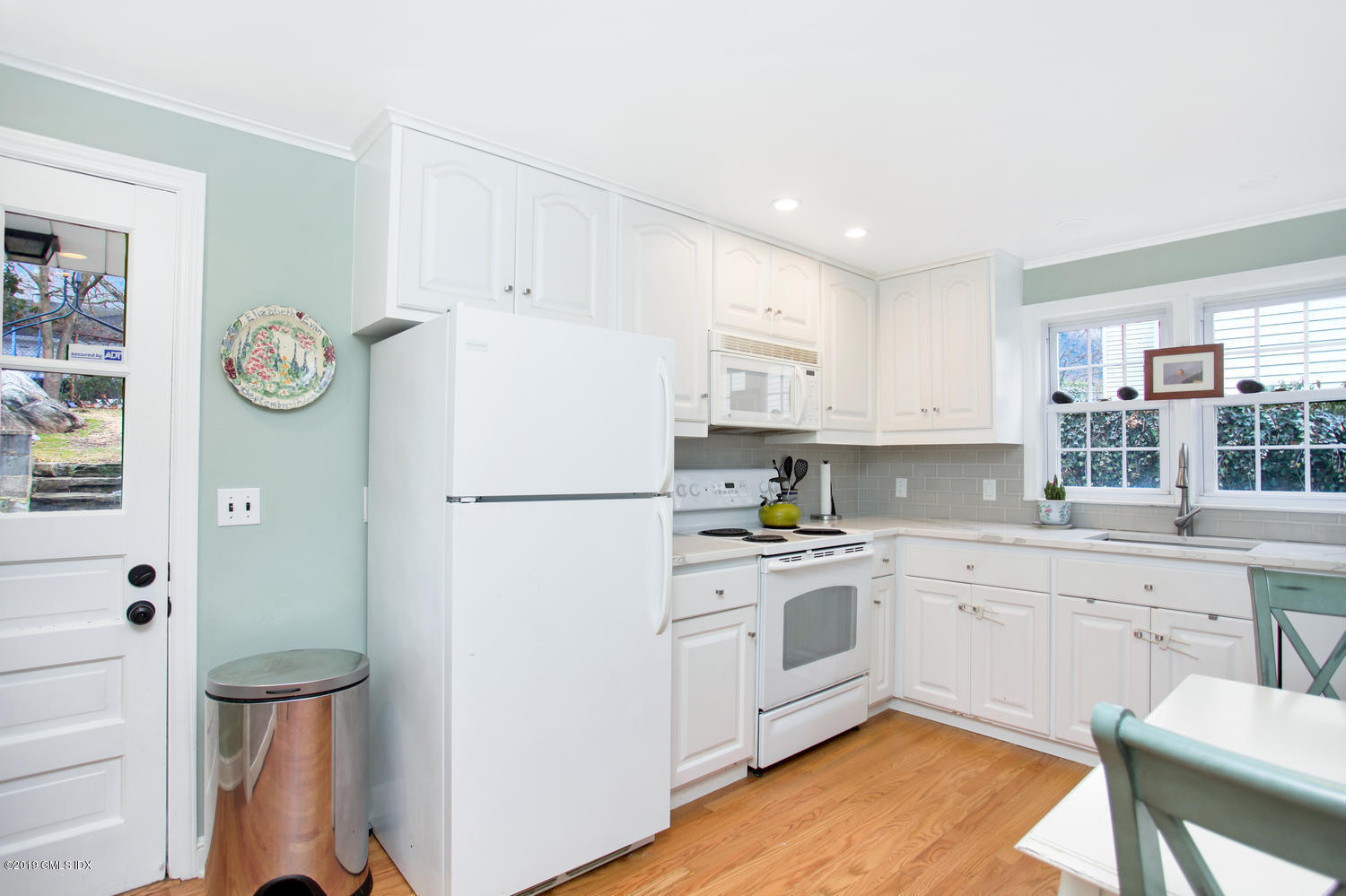 13 Hoover Road Riverside, CT 06878 - Photo 7 of 25 a kitchen with white cabinets and white appliances