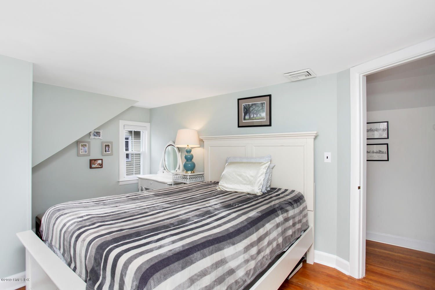 13 Hoover Road Riverside, CT 06878 - Photo 9 of 25 a bedroom with a bed and wooden floor
