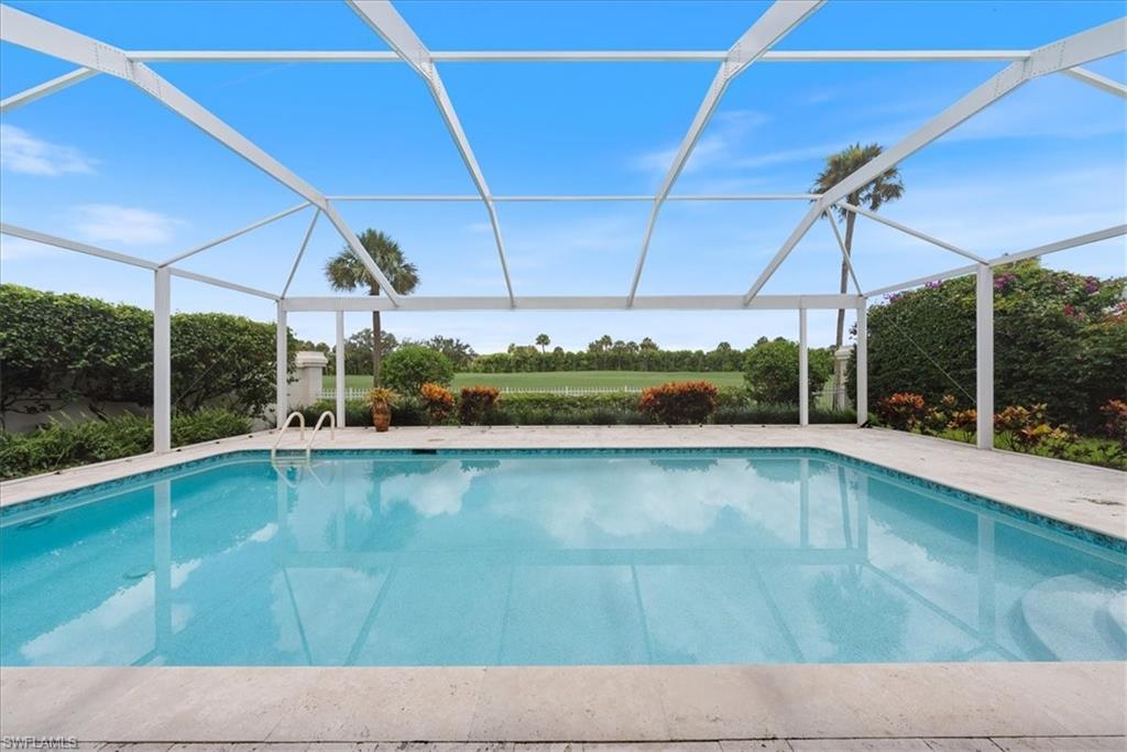 a view of a swimming pool with a porch