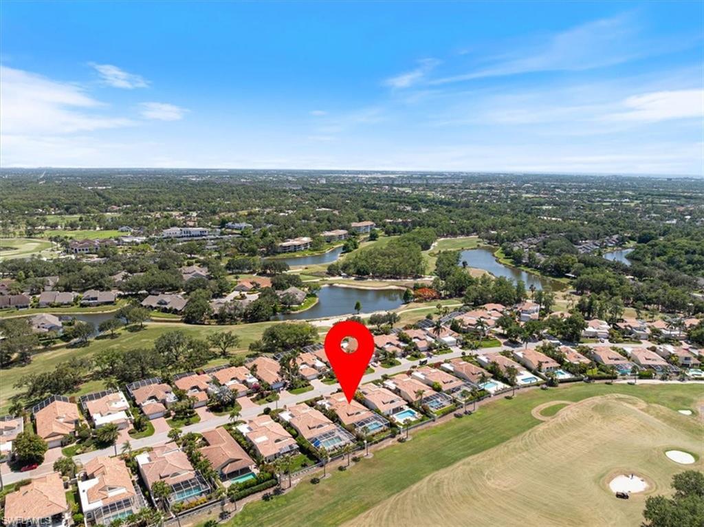 171 Via Napoli Naples, FL 34105 - Photo 2 of 45 an aerial view of a houses with a swimming pool