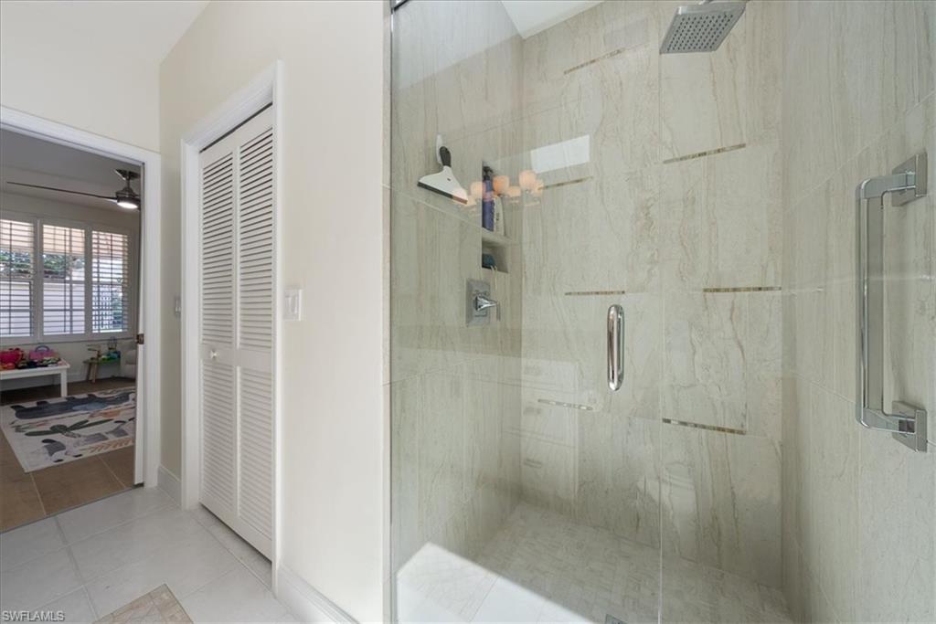 171 Via Napoli Naples, FL 34105 - Photo 25 of 45 a bathroom with a shower