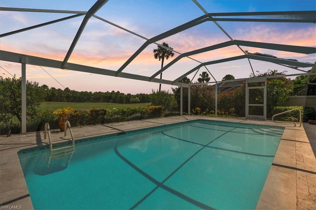 171 Via Napoli Naples, FL 34105 - Photo 29 of 45 a view of a swimming pool with a patio