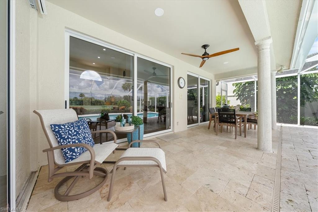 171 Via Napoli Naples, FL 34105 - Photo 32 of 45 a dining room with furniture and large windows