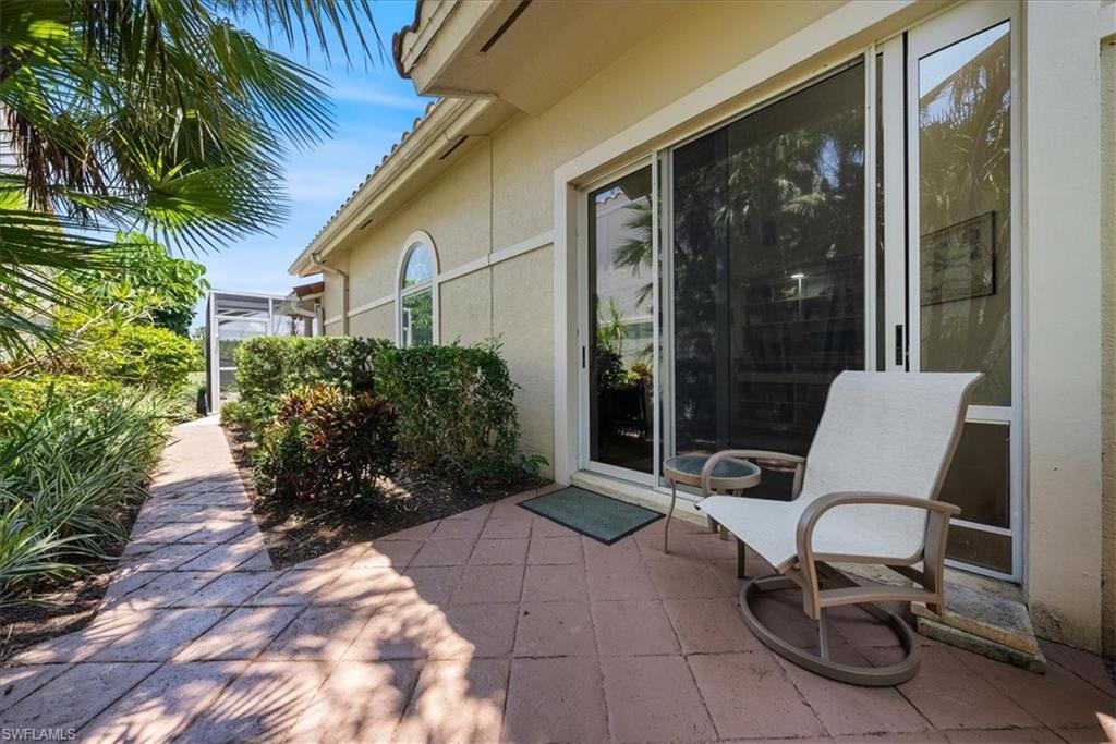 171 Via Napoli Naples, FL 34105 - Photo 34 of 45 a view of a patio with table and chairs and potted plants