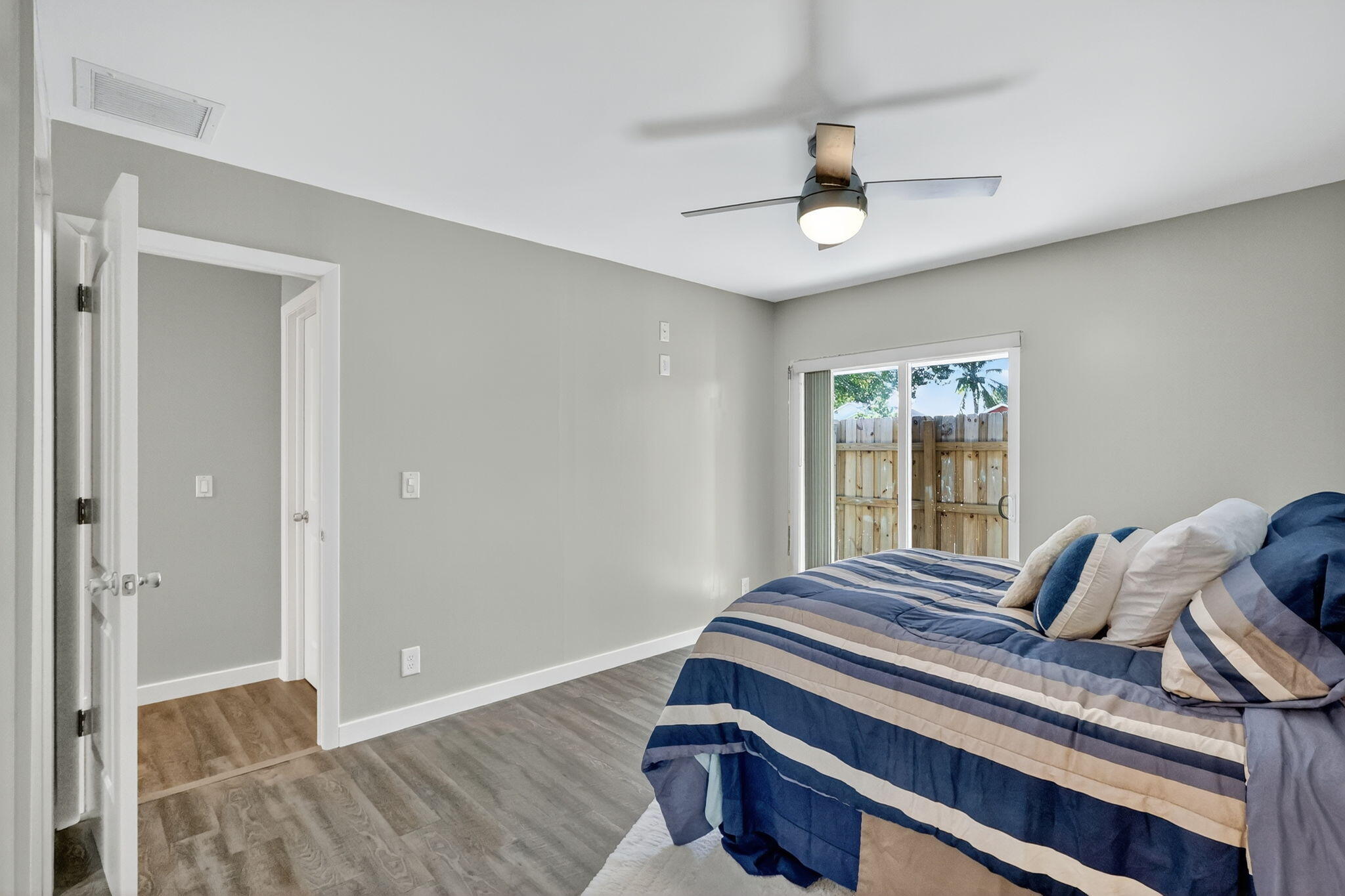 5785 Southeast Collins Avenue Stuart, FL 34997 - Photo 21 of 49 a bedroom with bed and a window