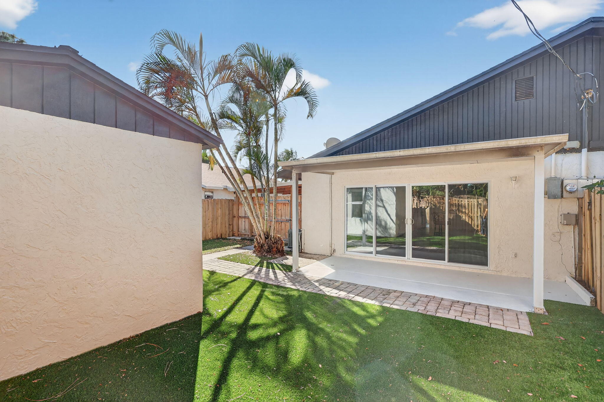 5785 Southeast Collins Avenue Stuart, FL 34997 - Photo 35 of 49 a house with garden in front of it