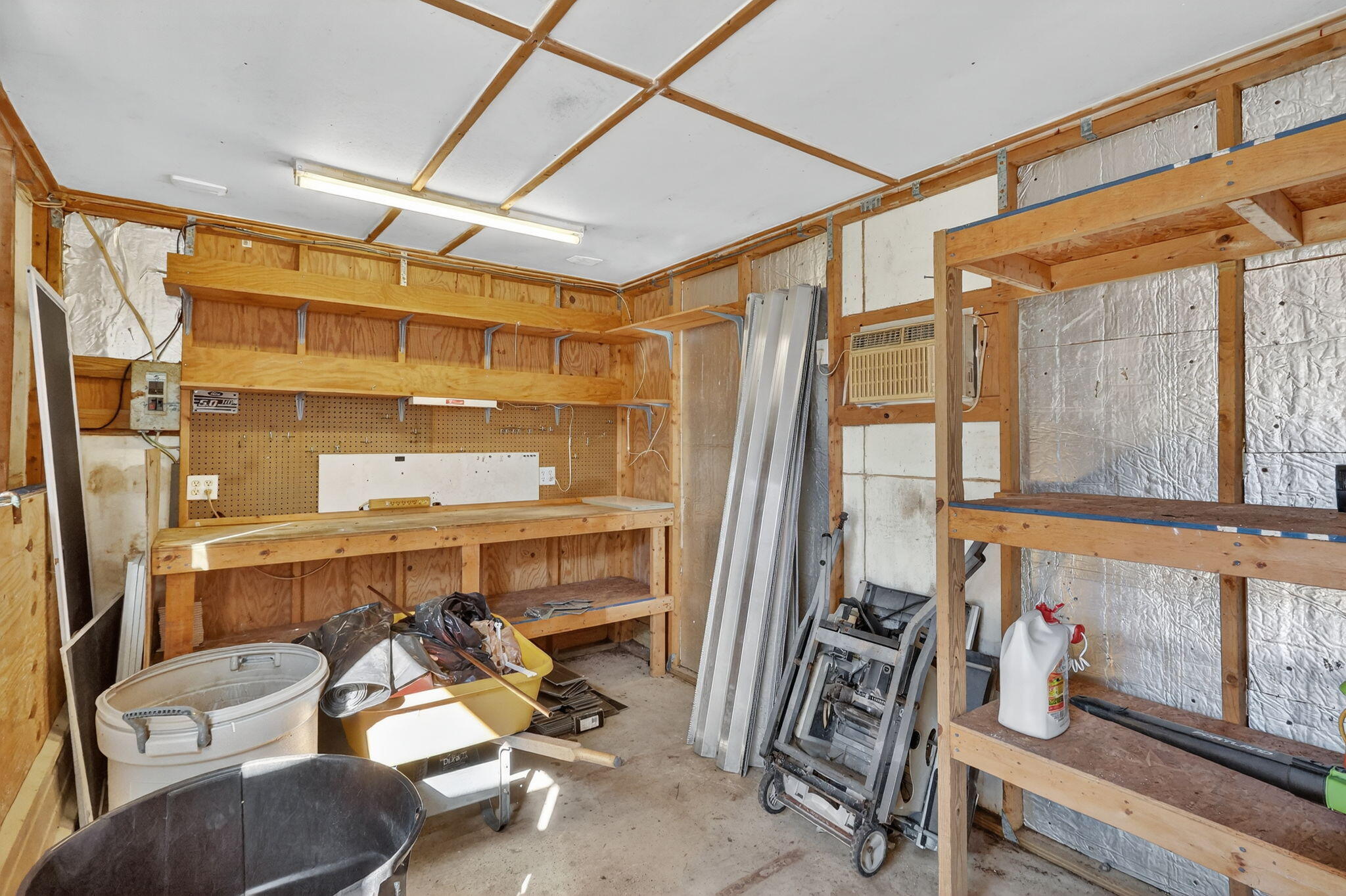 5785 Southeast Collins Avenue Stuart, FL 34997 - Photo 39 of 49 a room with furniture and windows