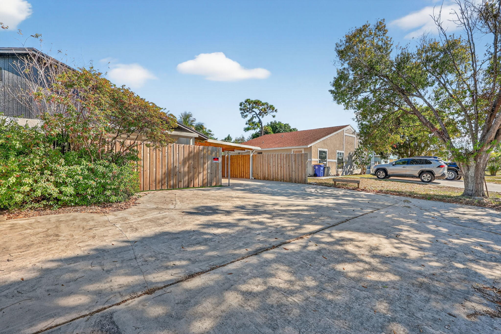 5785 Southeast Collins Avenue Stuart, FL 34997 - Photo 4 of 49 a house view with a outdoor space