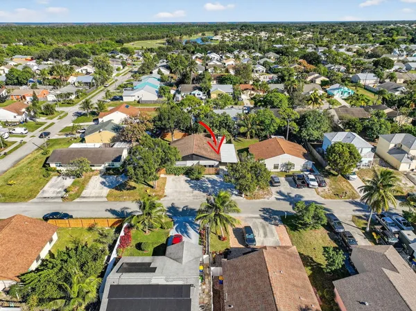 an aerial view of residential houses with outdoor space