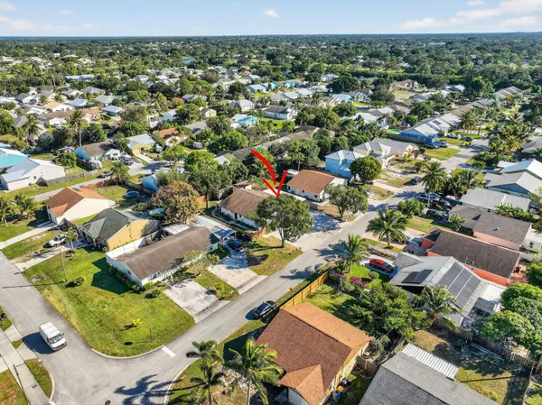 an aerial view of residential houses with outdoor space