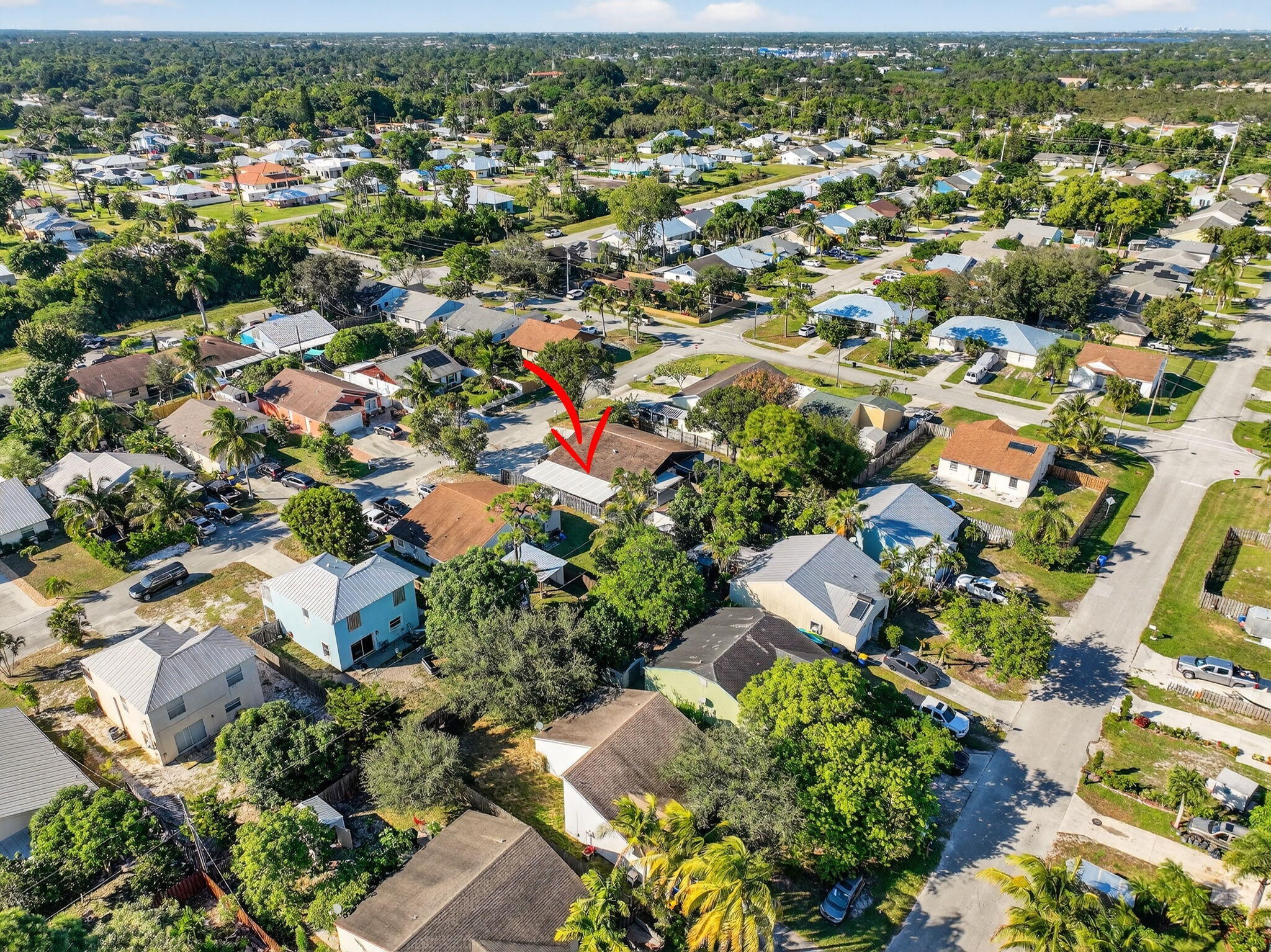 5785 Southeast Collins Avenue Stuart, FL 34997 - Photo 46 of 49 an aerial view of residential houses with outdoor space