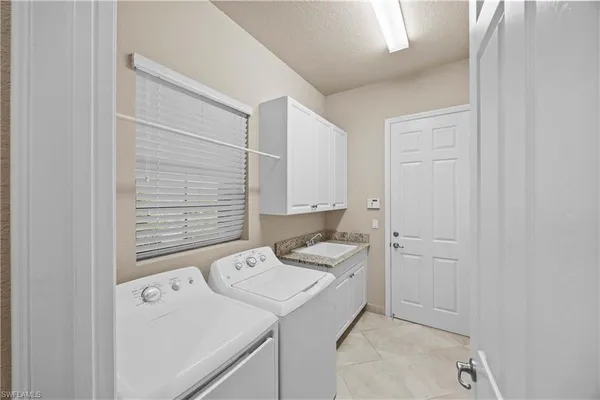a bathroom with a granite countertop toilet sink and shower