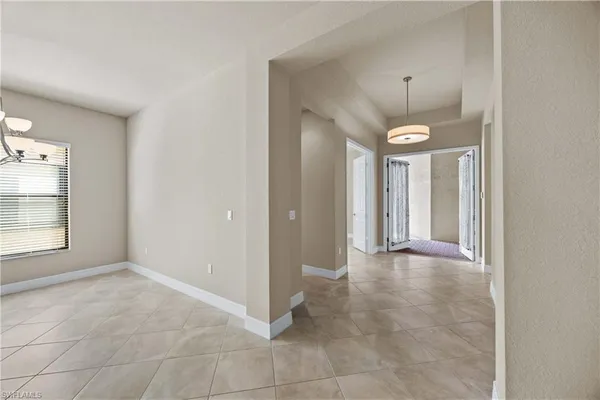 a view of a room that has a lot of cabinets