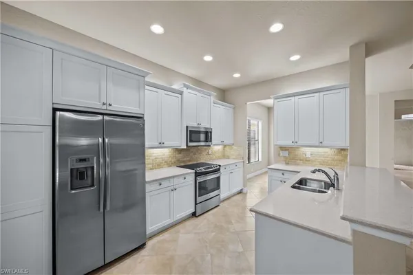 a view of kitchen and front door
