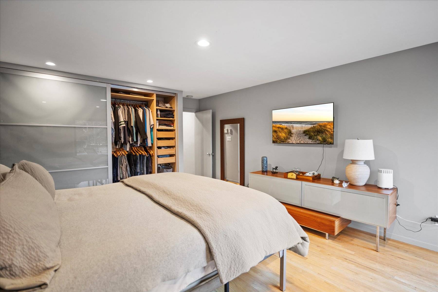 25 North Quarter Road Westhampton, NY 11977 - Photo 17 of 27 a bedroom with a bed and a flat screen tv