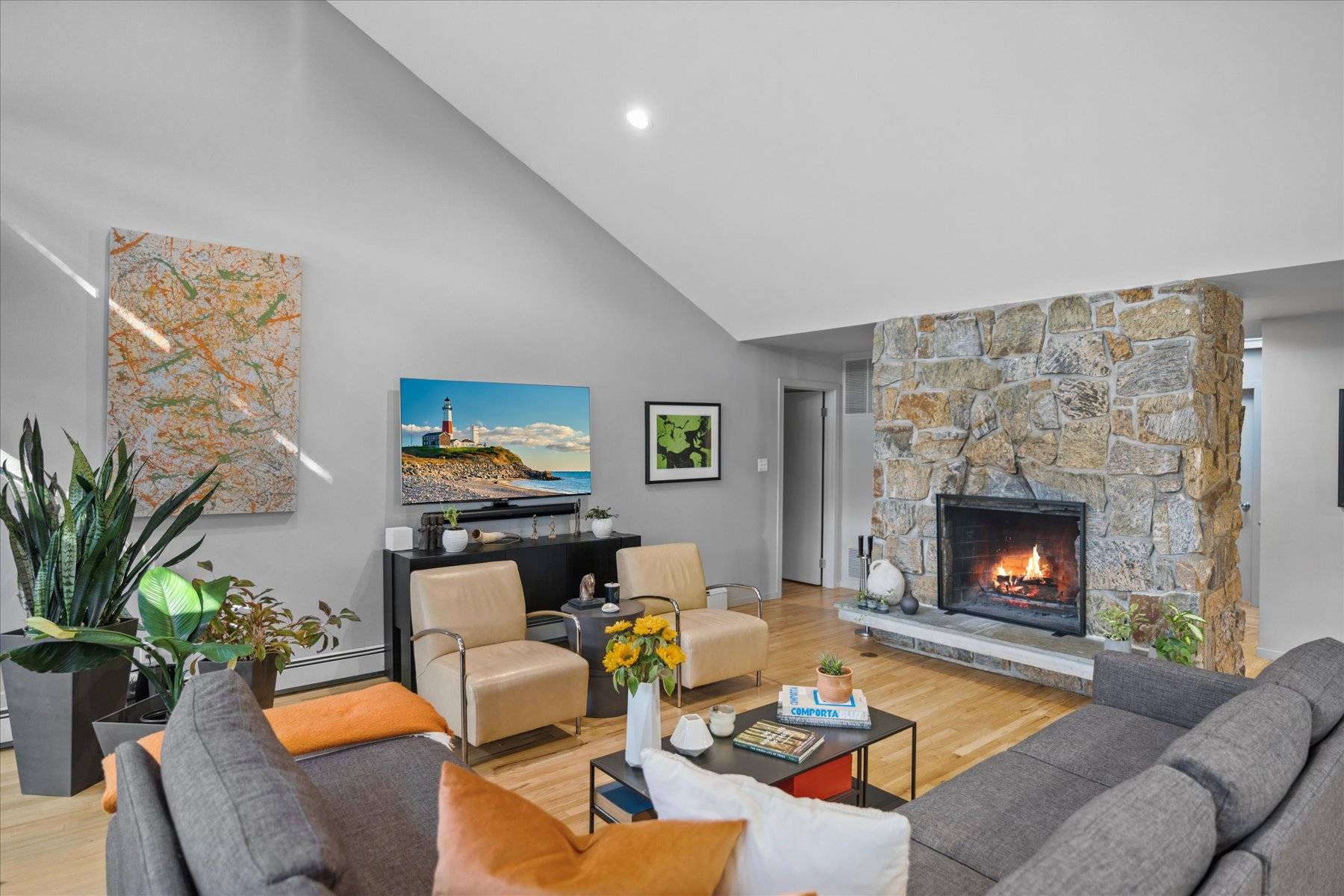 25 North Quarter Road Westhampton, NY 11977 - Photo 4 of 27 a living room with furniture fireplace and potted plant