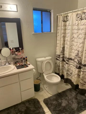 a bedroom with a bed and a desk