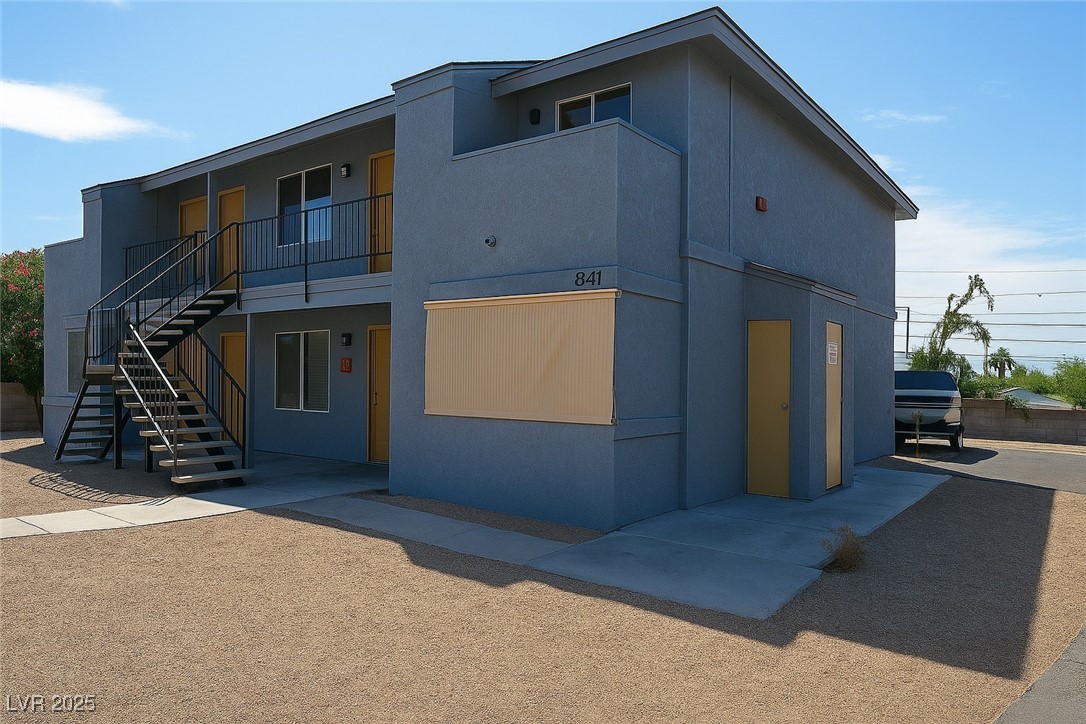 841 A Boulder City, NV 89005 - Photo 2 of 3 View of building exterior featuring stairway