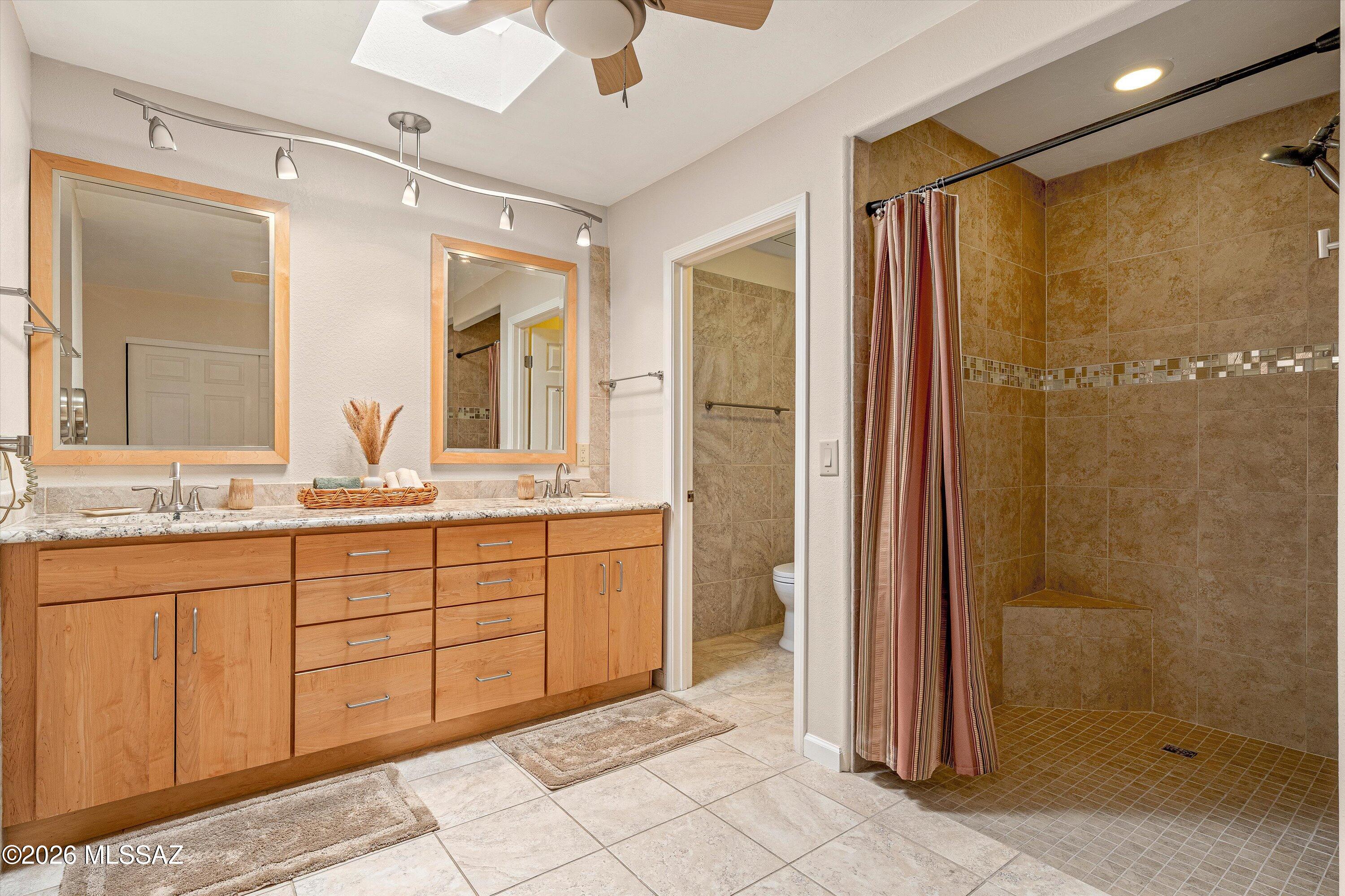 7402 East Wandering Road Tucson, AZ 85750 - Photo 19 of 38 Roll in shower! Dual vanity, lots of room here!
