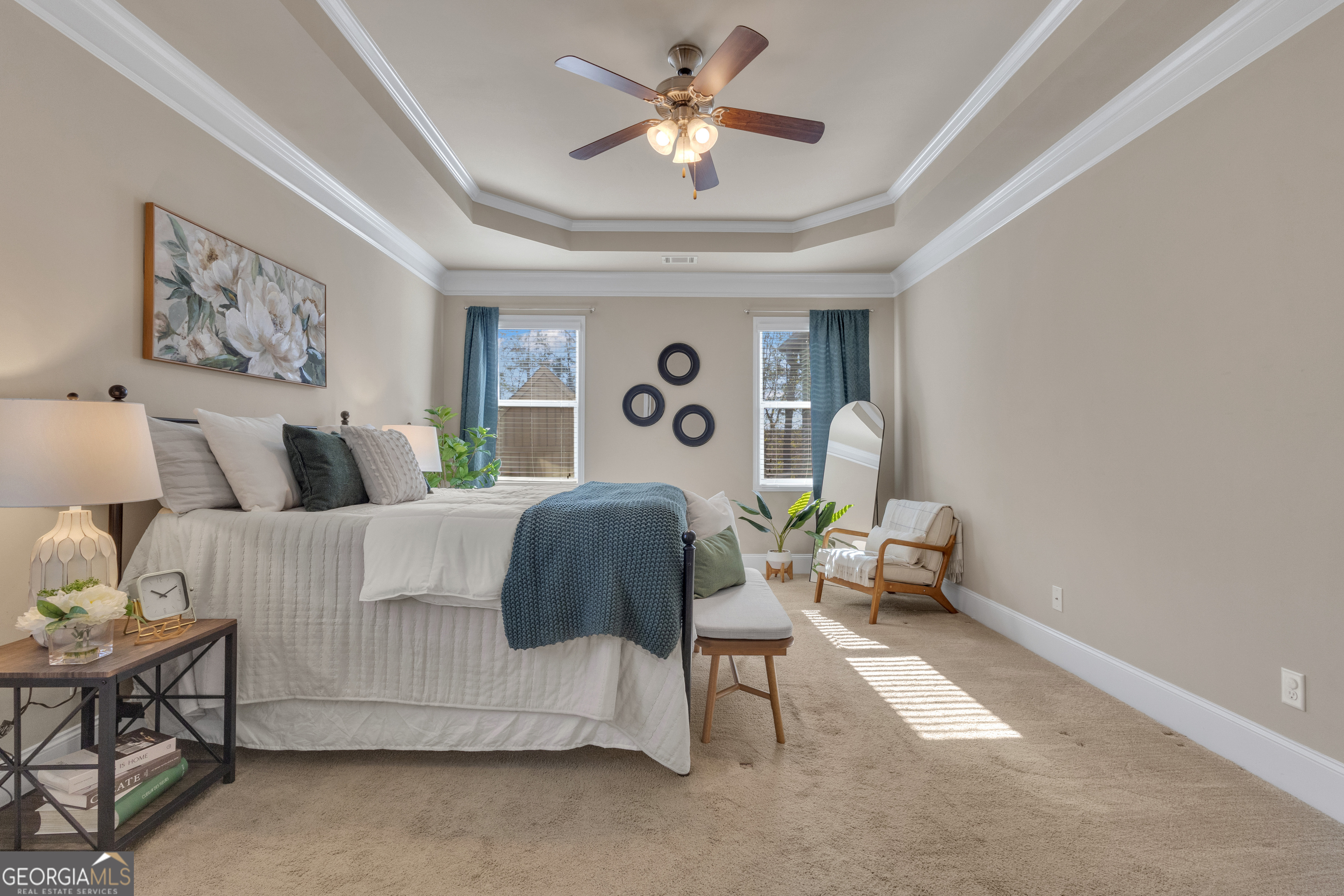 170 Savannah Drive Senoia, GA 30276 - Photo 11 of 60 a bedroom with a bed and a chandelier