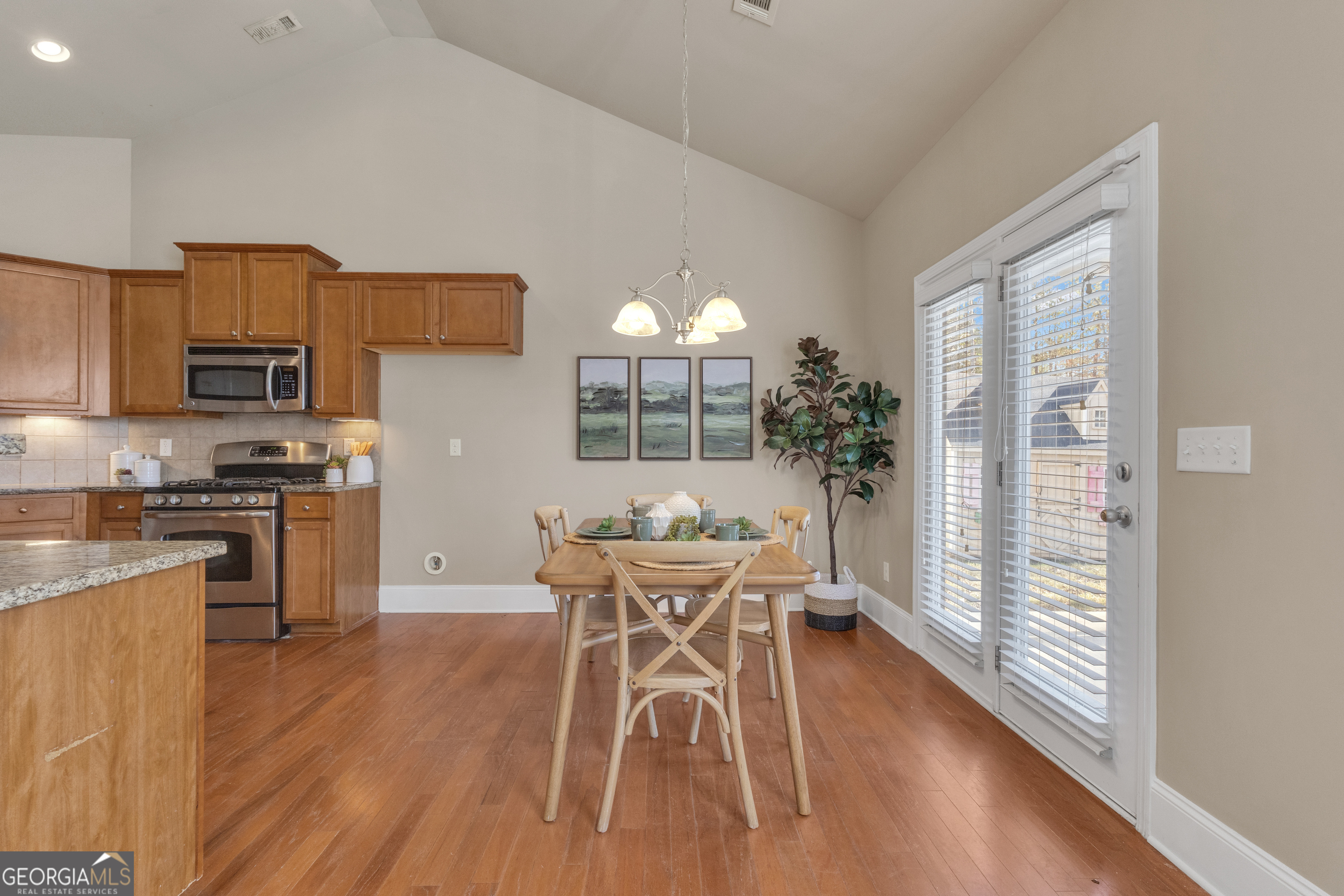170 Savannah Drive Senoia, GA 30276 - Photo 23 of 60 a view of a dining room with furniture a chandelier and wooden floor