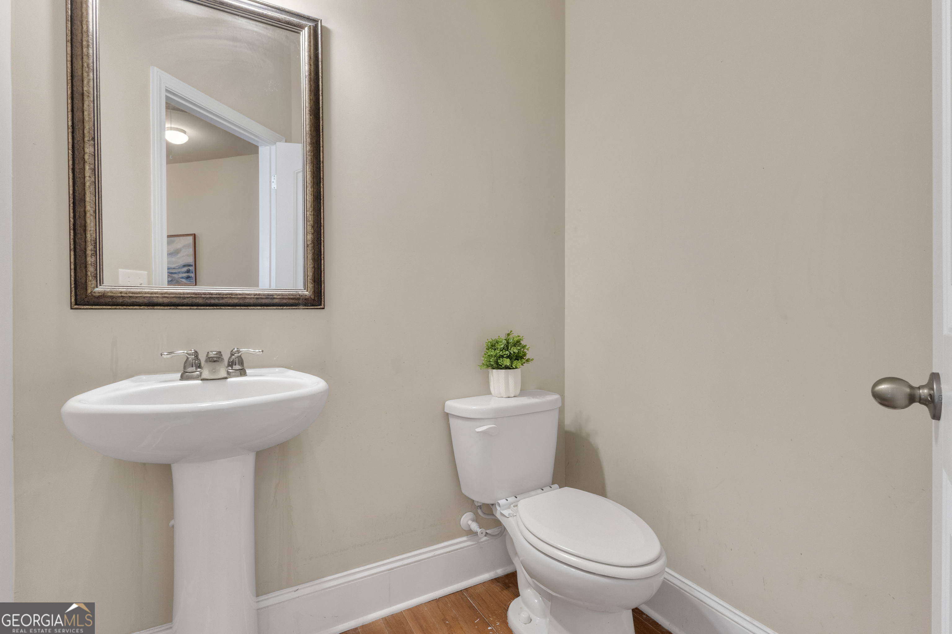 170 Savannah Drive Senoia, GA 30276 - Photo 35 of 60 a bathroom with a sink a toilet and mirror