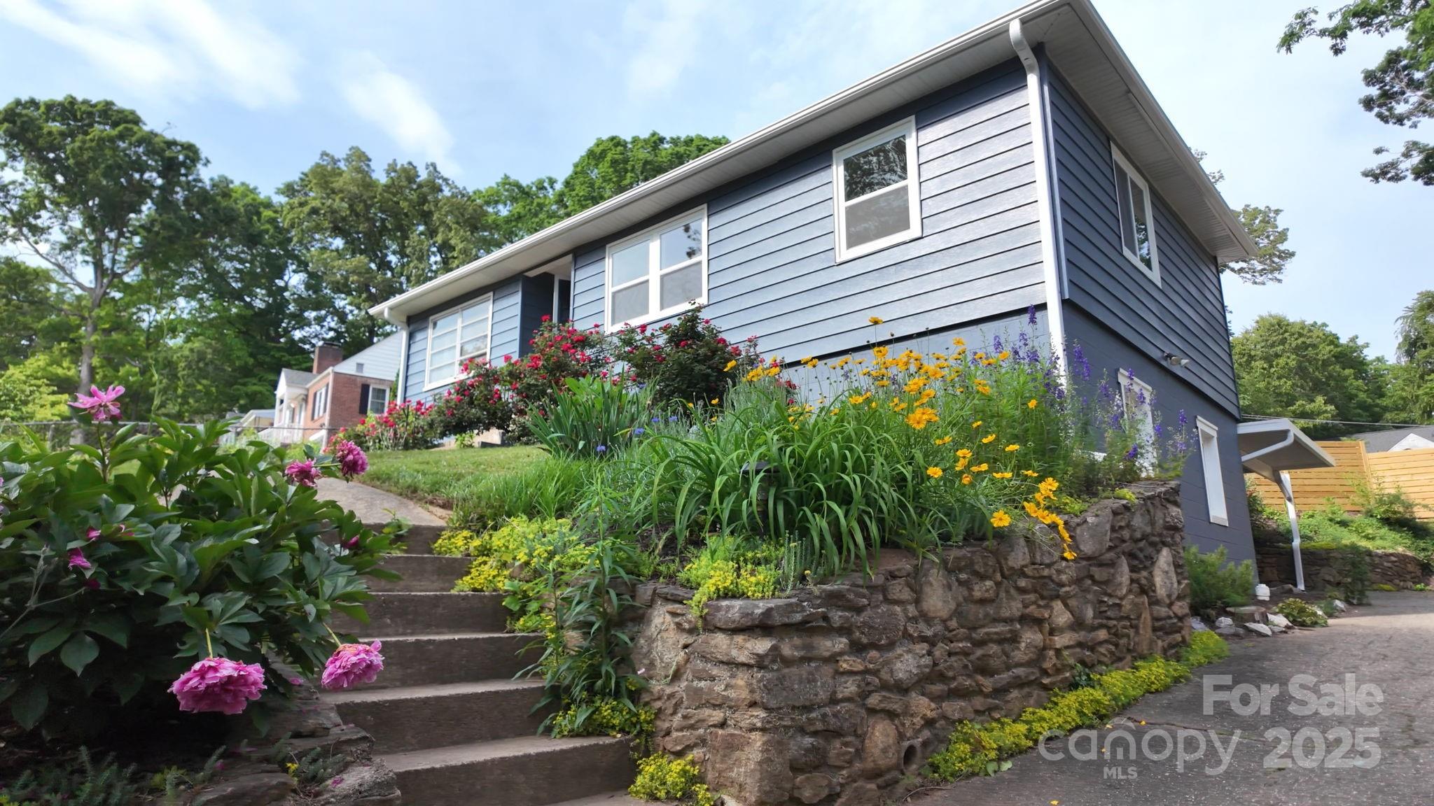 12 Canterbury Road Asheville, NC 28805 - Photo 2 of 44 a front view of a house with plants
