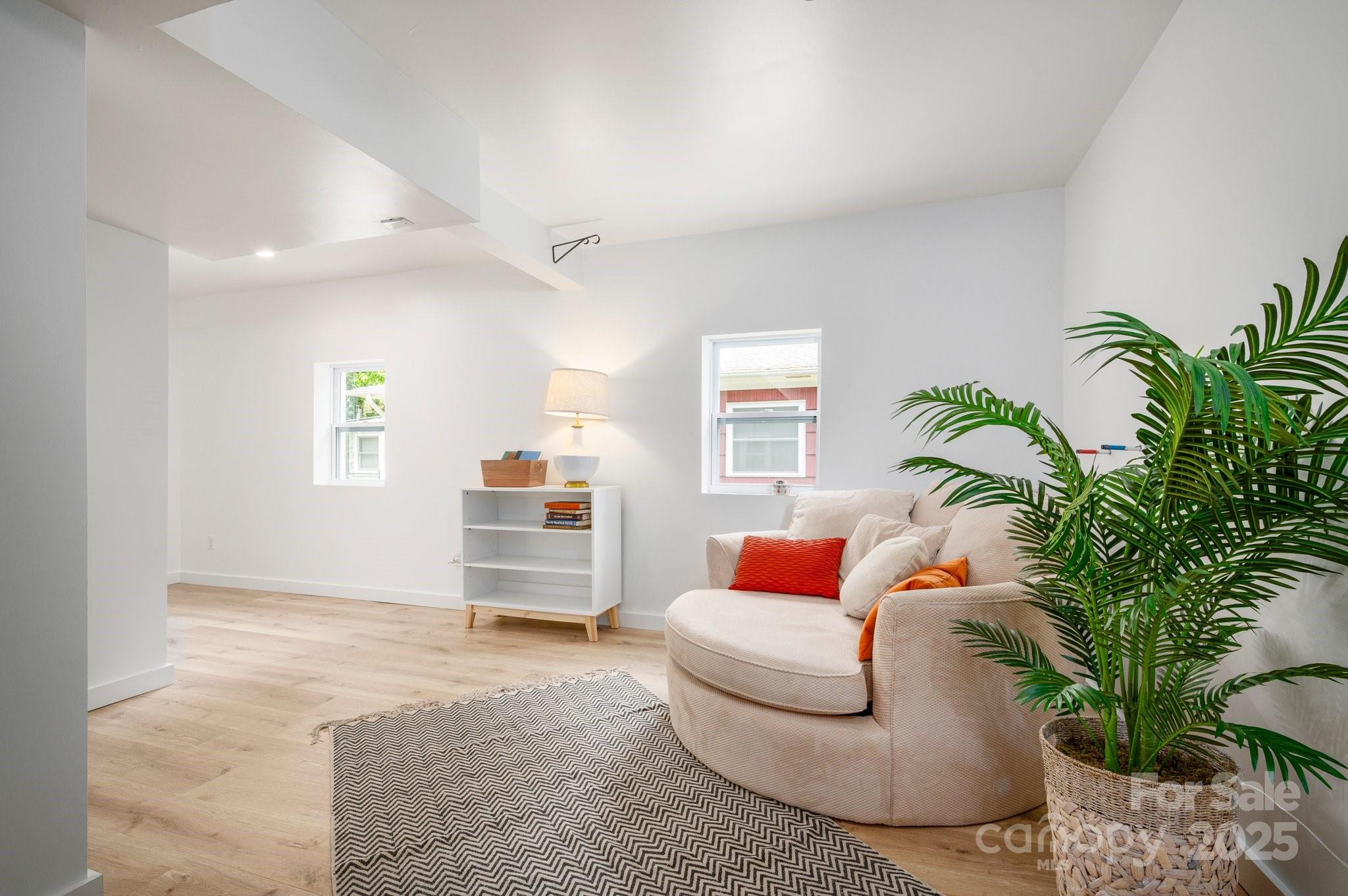 12 Canterbury Road Asheville, NC 28805 - Photo 27 of 44 a living room with furniture and a potted plant