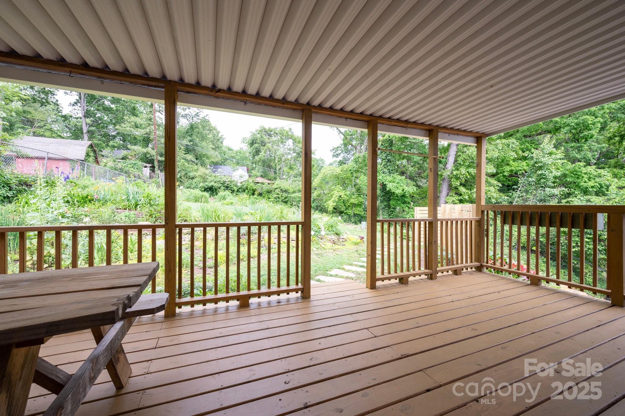 12 Canterbury Road Asheville, NC 28805 - Photo 29 of 44 a view of a wooden deck with a patio
