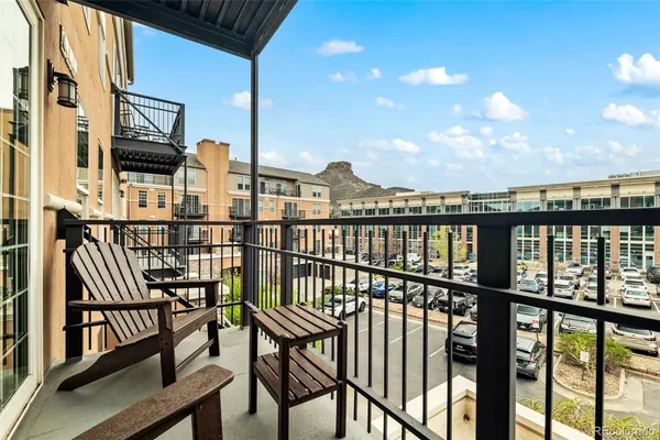 a view of a balcony with chairs