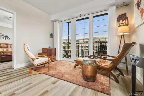 a work room with wooden floor and furniture