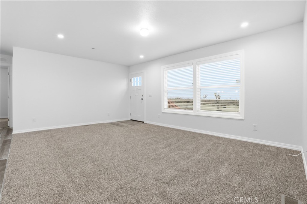 4237 Del Rosa Road Phelan, CA 92371 - Photo 12 of 37 an empty room with windows