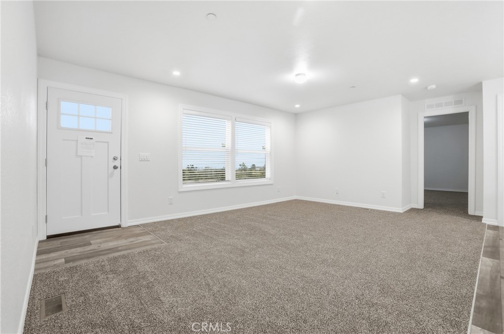 4237 Del Rosa Road Phelan, CA 92371 - Photo 13 of 37 a view of an empty room with a window