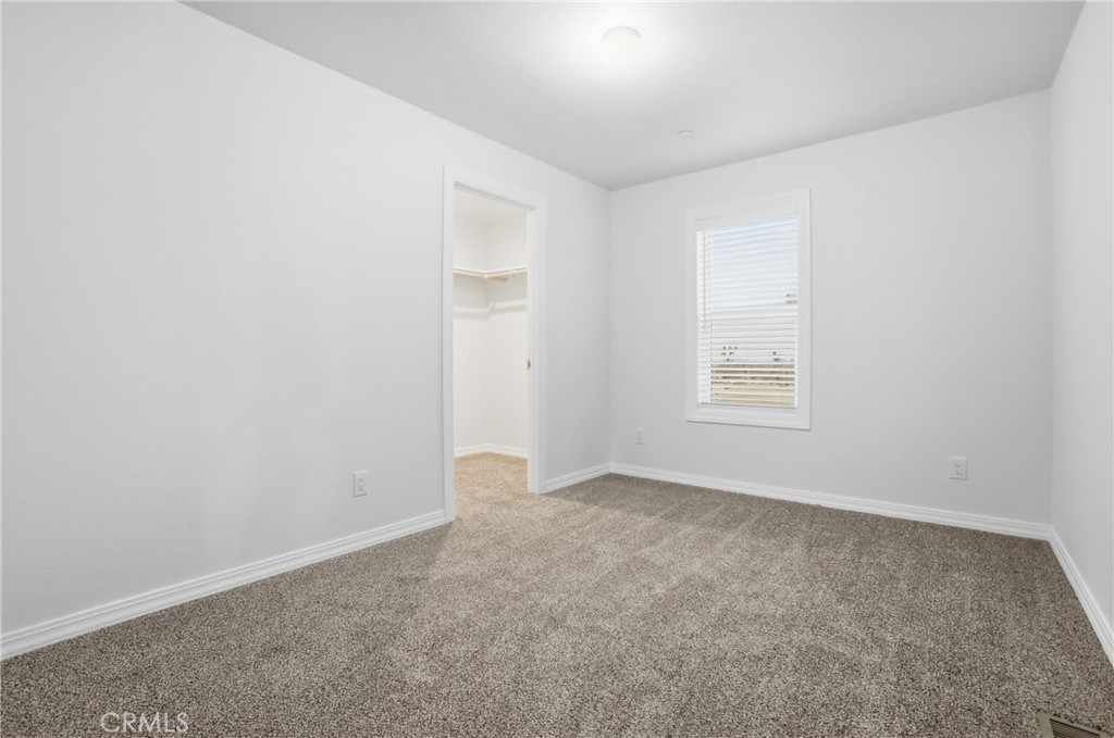 4237 Del Rosa Road Phelan, CA 92371 - Photo 17 of 37 an empty room with windows