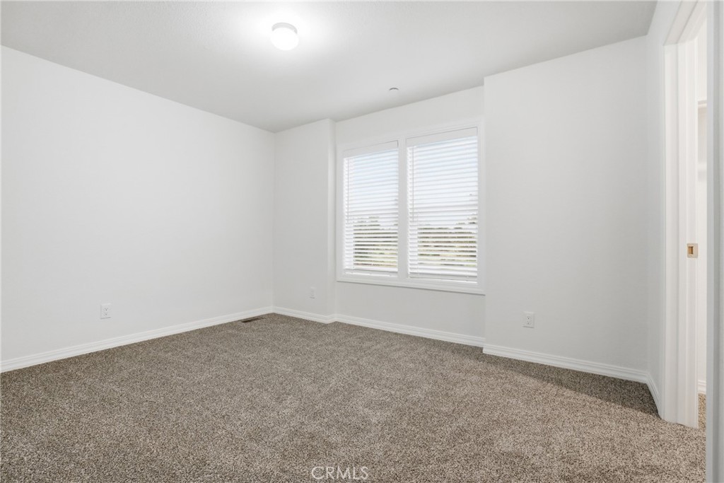 4237 Del Rosa Road Phelan, CA 92371 - Photo 21 of 37 an empty room with windows