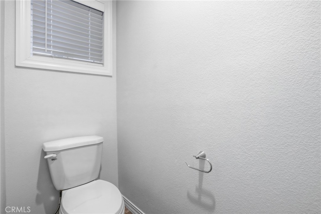 4237 Del Rosa Road Phelan, CA 92371 - Photo 28 of 37 a white toilet sitting next to a window