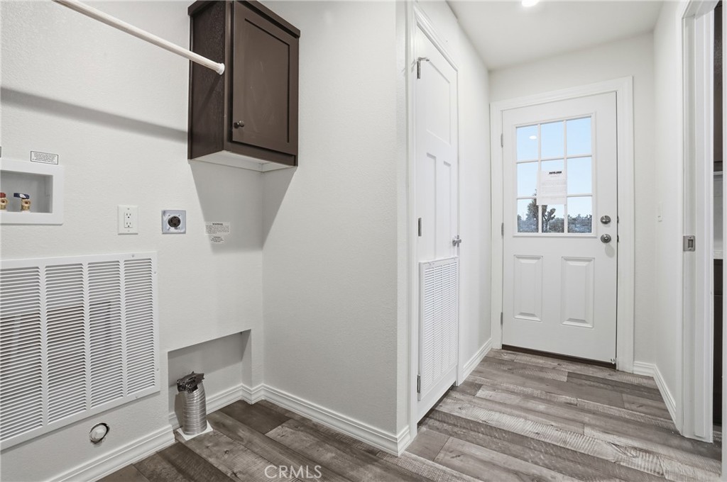 4237 Del Rosa Road Phelan, CA 92371 - Photo 29 of 37 a view of a hallway with wooden floor and entryway