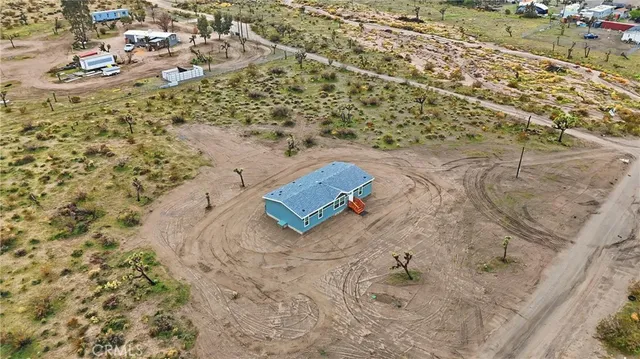 an aerial view of residential building and ocean