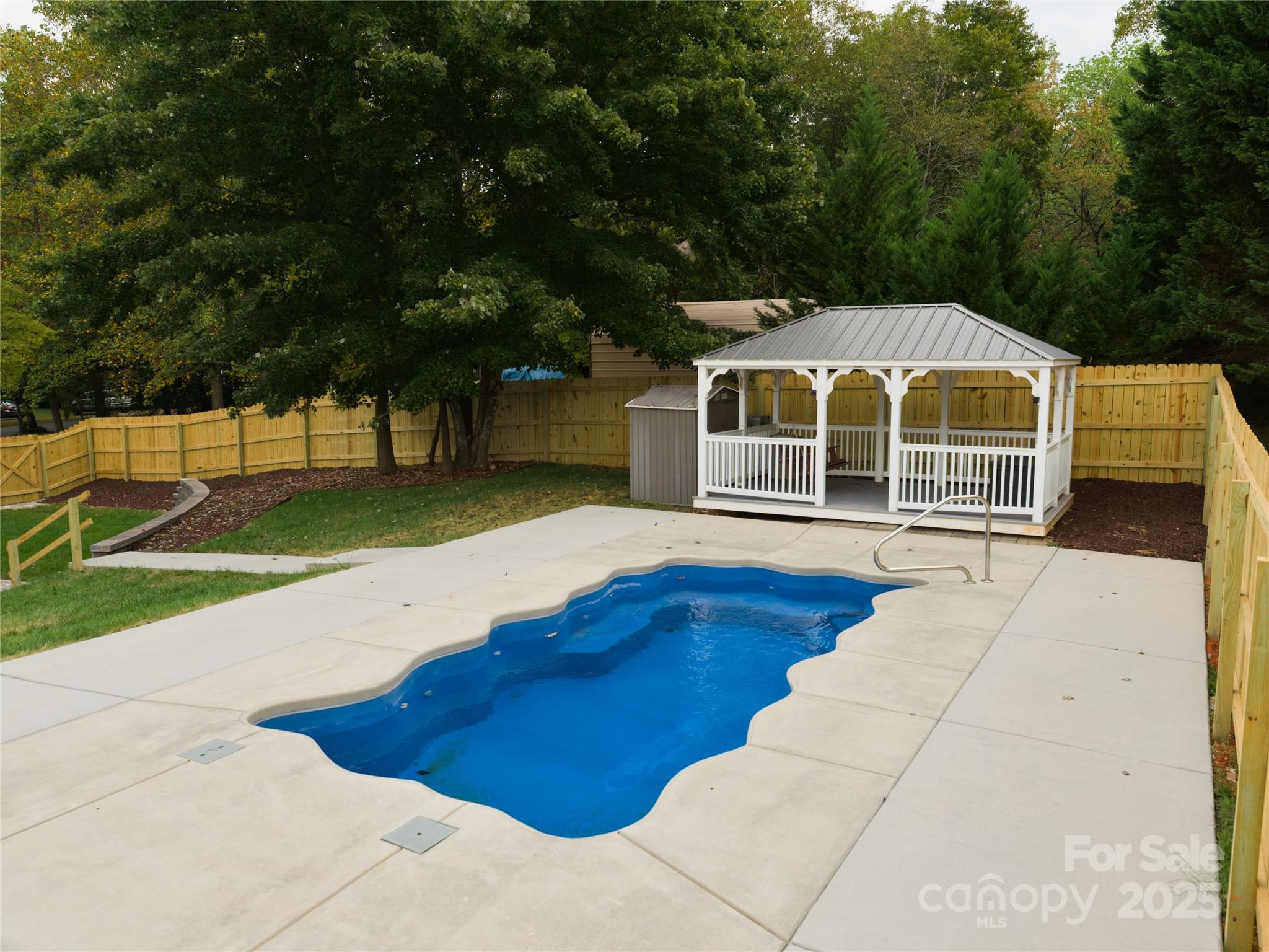 206 Montclair Drive Locust, NC 28097 - Photo 11 of 46 a view of a house with pool and yard