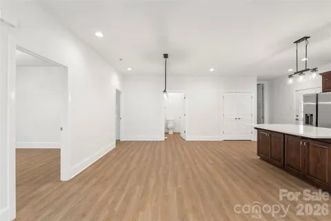 a bedroom with a bed a mirror and desk