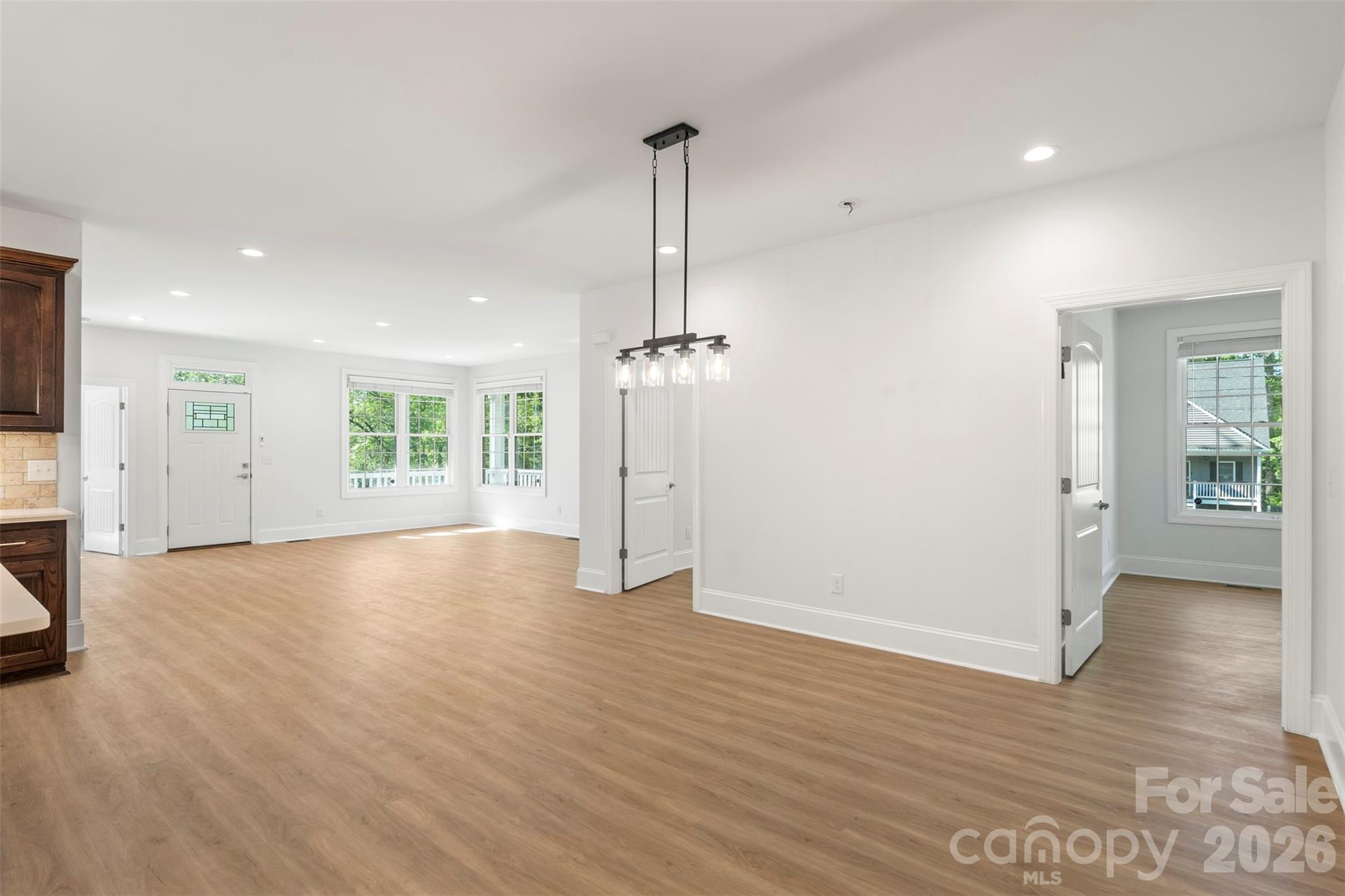 206 Montclair Drive Locust, NC 28097 - Photo 16 of 40 a view of empty room with wooden floor and window