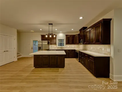 a bathroom with a sink and mirror with toilet