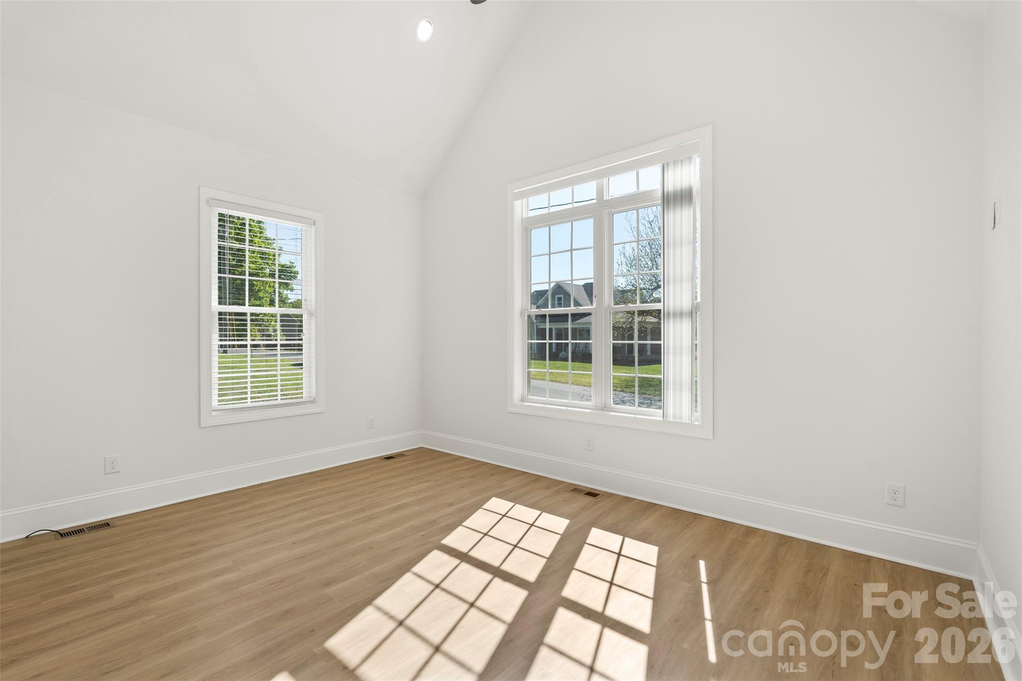 206 Montclair Drive Locust, NC 28097 - Photo 20 of 40 a view of an empty room with wooden floor and a window