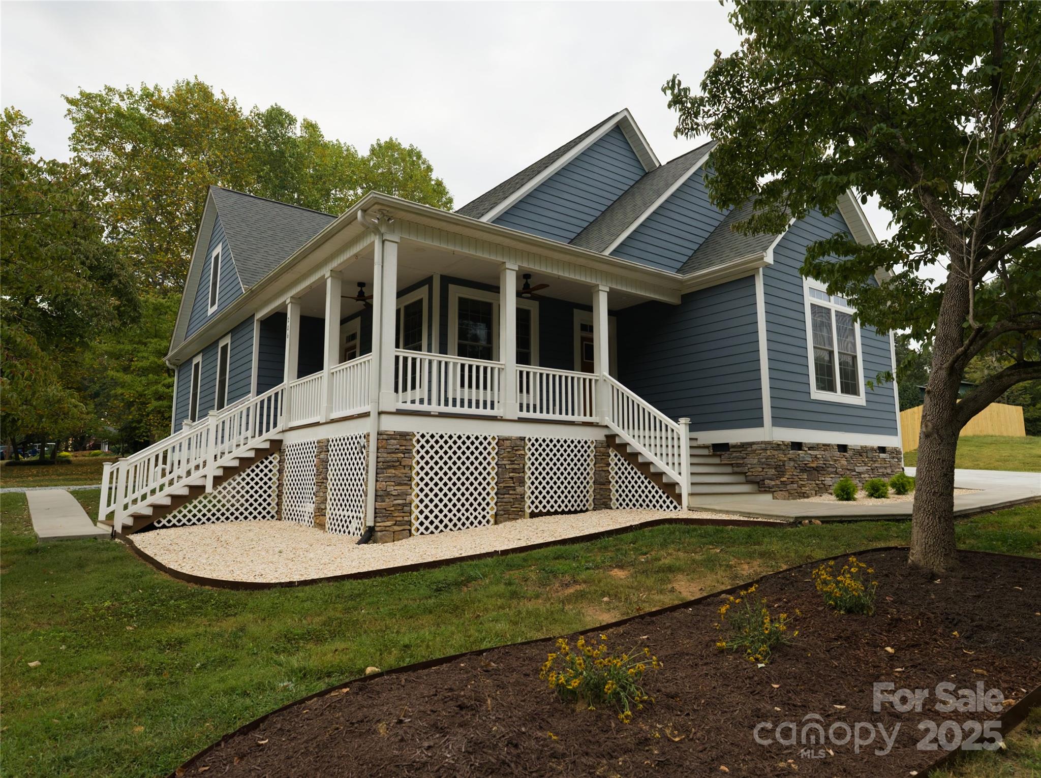 206 Montclair Drive Locust, NC 28097 - Photo 2 of 46 a front view of a house with a yard