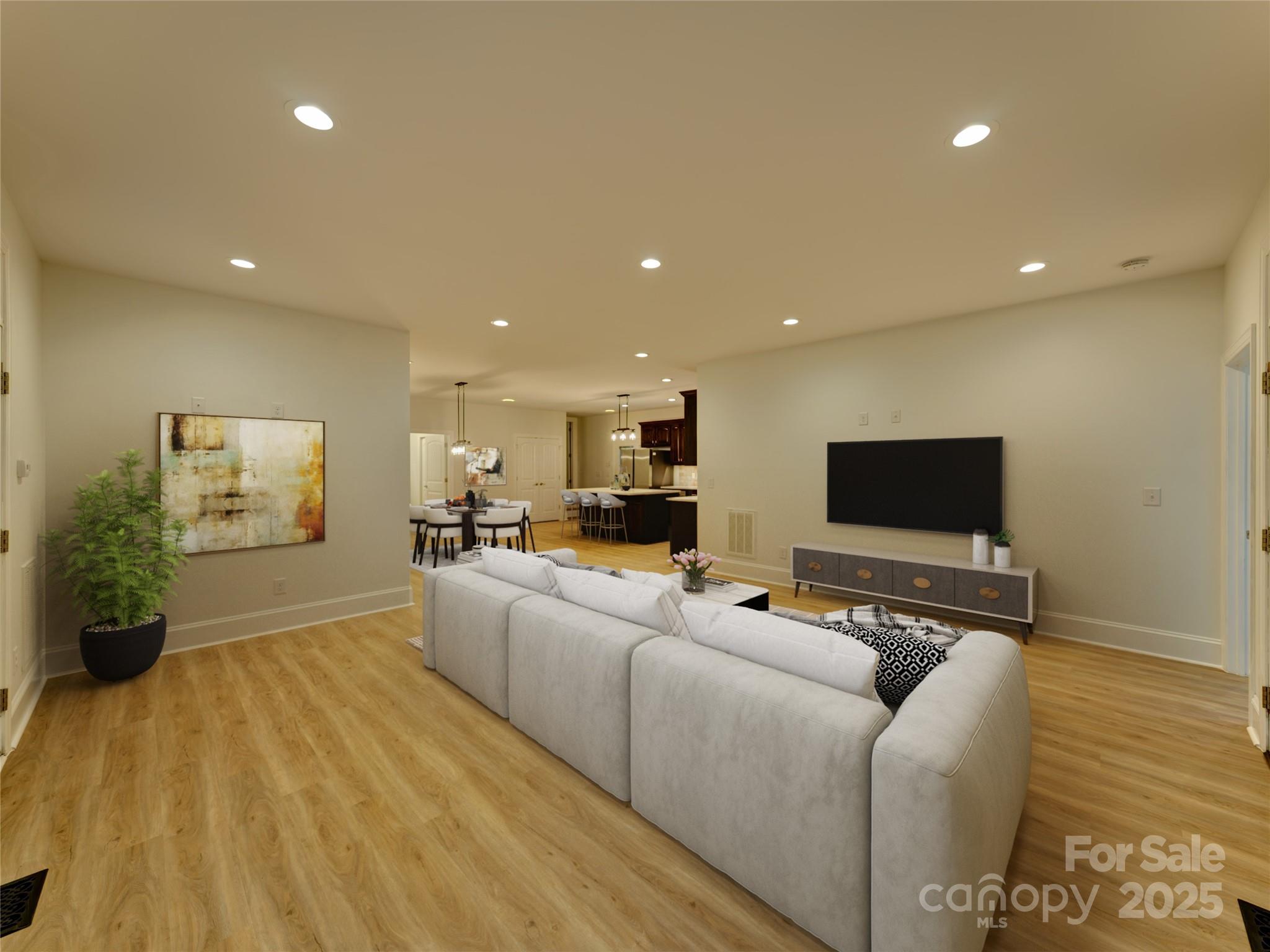 206 Montclair Drive Locust, NC 28097 - Photo 21 of 46 a living room with furniture and a flat screen tv