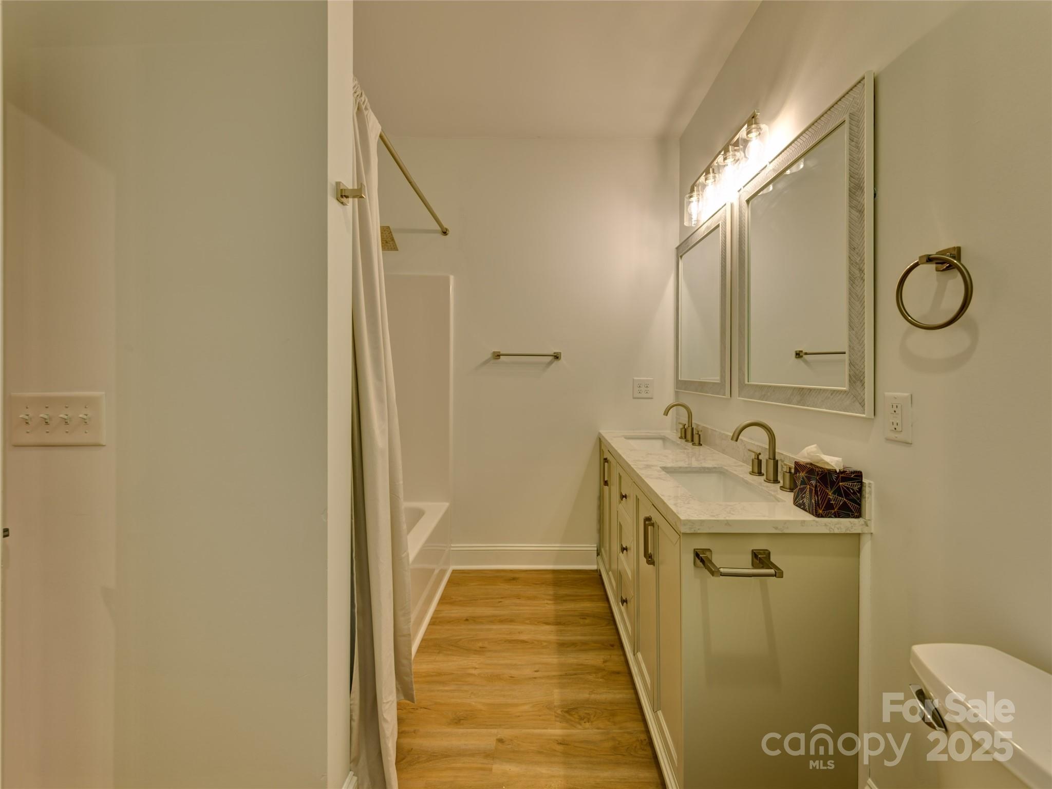 206 Montclair Drive Locust, NC 28097 - Photo 26 of 46 a bathroom with a sink and mirror with toilet