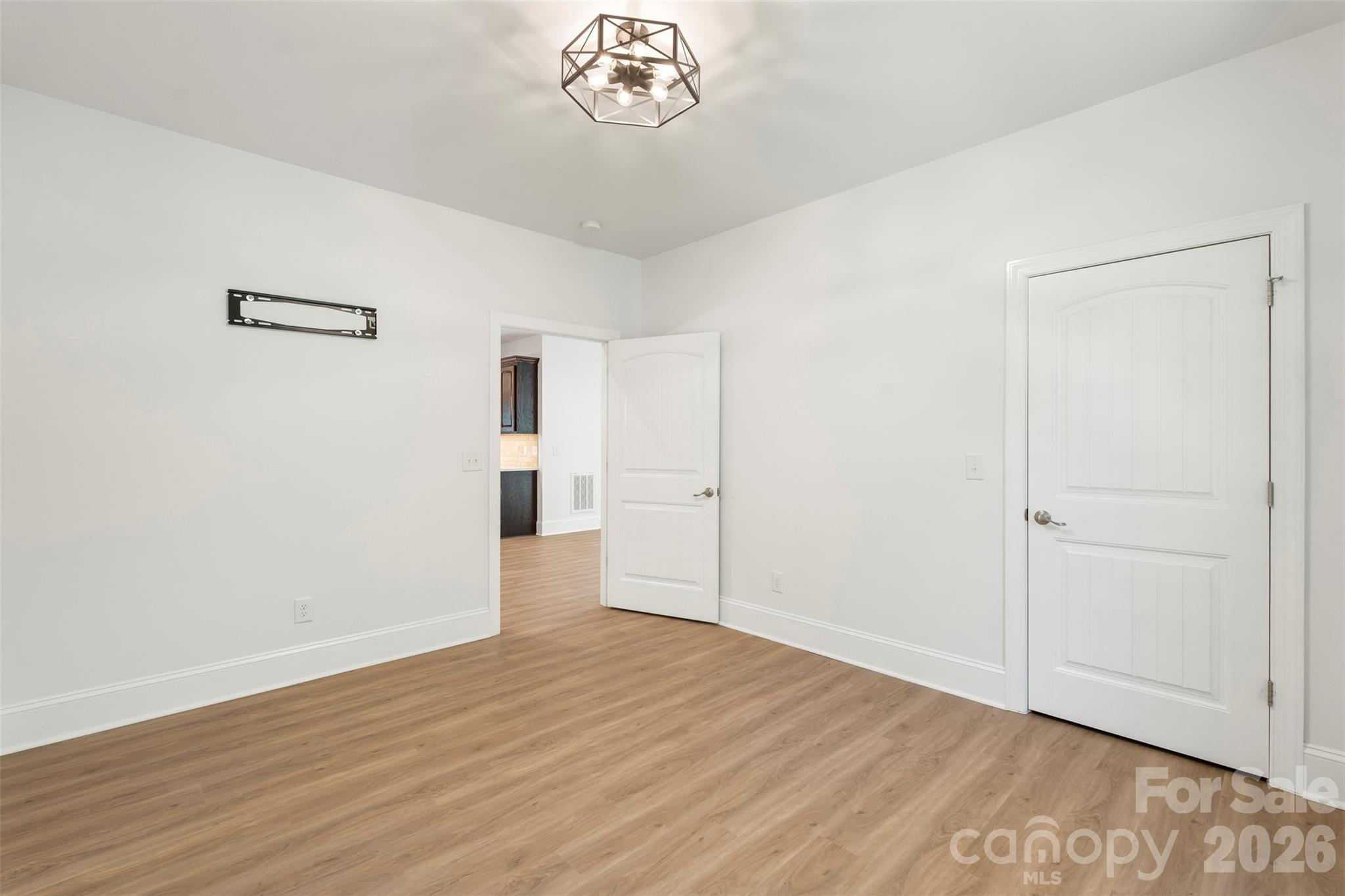 206 Montclair Drive Locust, NC 28097 - Photo 27 of 40 a view of empty room with wooden floor