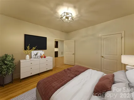 a view of a kitchen with a refrigerator a ceiling fan and wooden floor