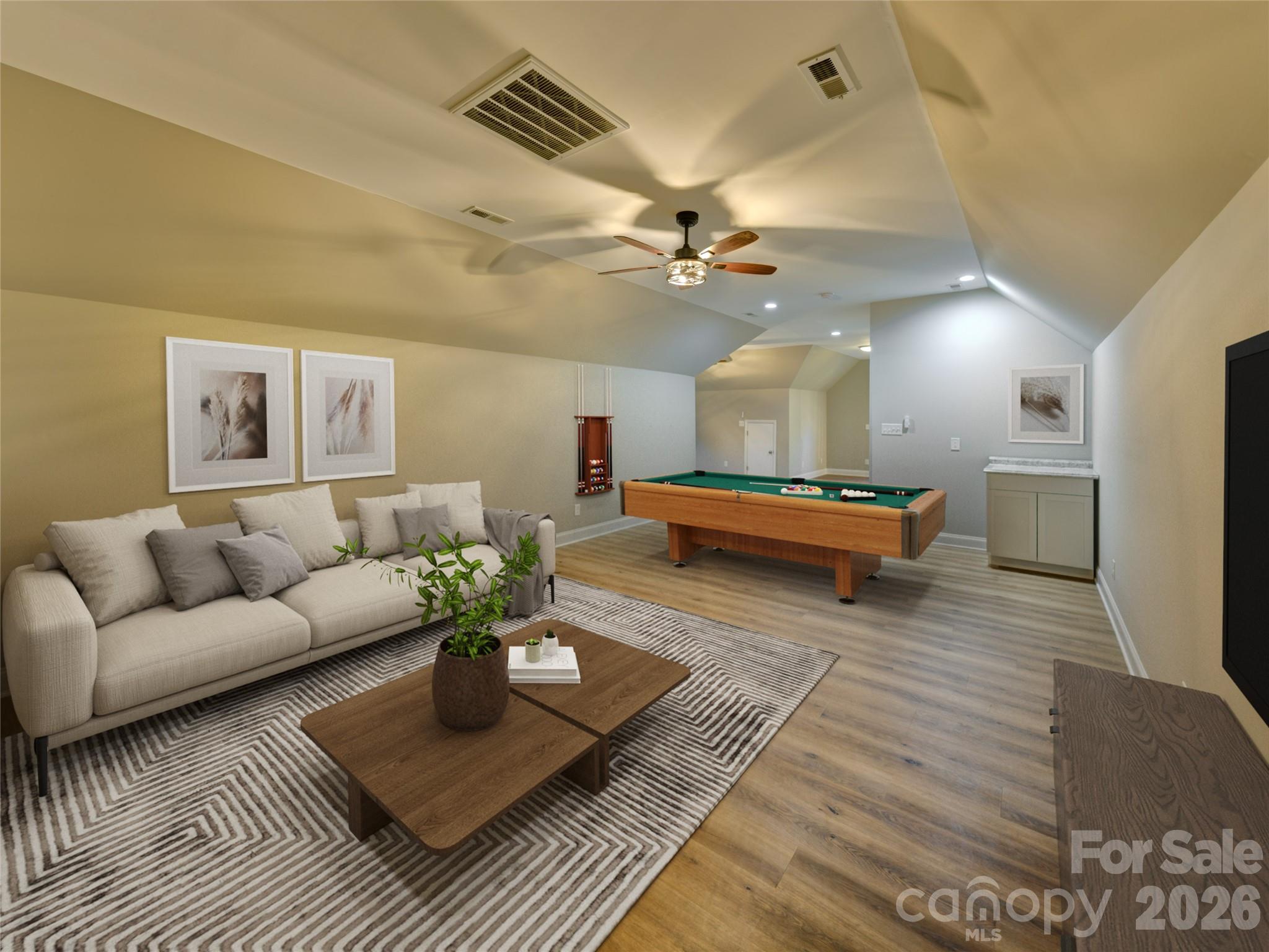 206 Montclair Drive Locust, NC 28097 - Photo 32 of 40 a living room with furniture and a chandelier