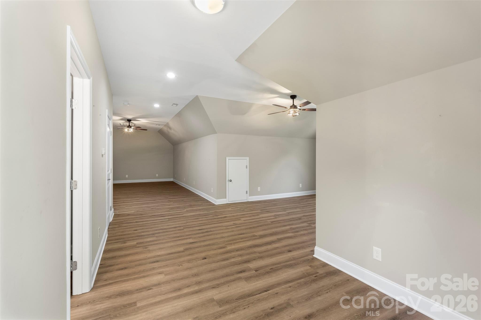 206 Montclair Drive Locust, NC 28097 - Photo 33 of 40 a view of a hallway with wooden floor
